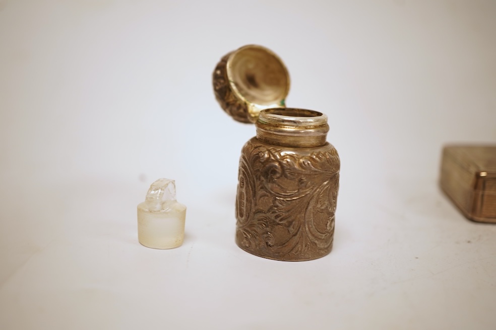 A Victorian engraved silver snuff box, Yapp & Woodward, Birmingham, 1899, 68mm, a small silver scent bottle and two silver-mounted glass scent bottles.